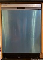 Full frontal view of dishwasher installed in cabinetry