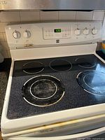 Front view of Kenmore range showing cooktop, control panel and brand logo