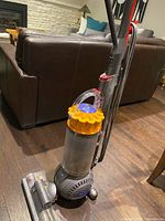 Full view of Dyson DC66 upright vacuum showing canister, ball base, motorhead