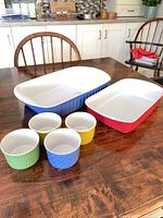 Full set on table showing two baking dishes and four ramekins