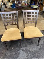 Front view of both chairs showing lattice backs and beige seats