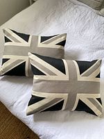 Both Urban Loft Union Jack pillows displayed on bed