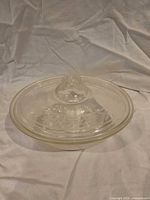 Side view showing casserole and Victor lid with etched pattern