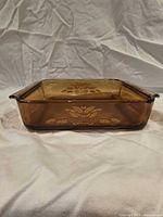 Full view of amber glass loaf dish with wheat pattern