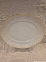 Full view of oval milk glass platter on stand