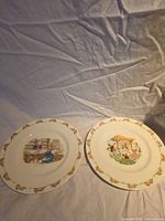 Both Bunnykins plates side by side showing overall designs and condition