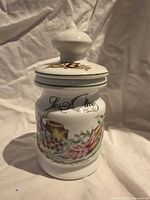 Front view of ceramic olive jar showing design and "Les Olive" text