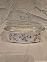 Side view of casserole showing Blue Dusk floral motif and clear lid