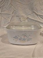 Front view of casserole dish showing Country Cornflower pattern and lid