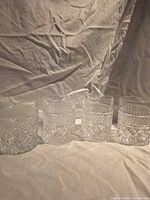 Four matching cut crystal whiskey glasses front view