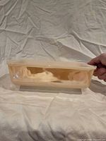 Side view of entire peach lustre loaf pan