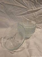 Stacked view of six frosted glass bowls, one displayed upright