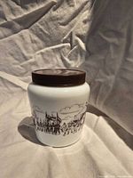 Front view jar showing parade graphic and lid