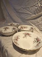 Four identical Royal Albert bowls displayed