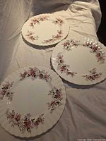Three Royal Albert Lavender Rose salad plates top view