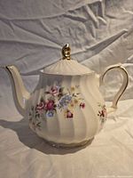 Full view showing floral design and gold trim