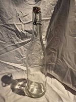Full view of bottle showing overall shape and swing-top