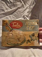 Top of Tala Icing Set box with graphic of cake and brand logo