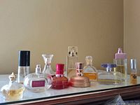 Group shot of all eleven perfume bottles on shelf