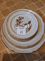 Stacked dinner and salad plates showing pattern