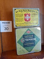 Front view showing both Camphor tin and Herb Tea box
