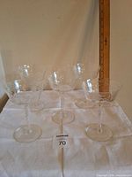 Group of six glasses shown; lot card 70 present, measuring stick in background indicates ~6 in height
