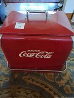 Front view showing Drink Coca-Cola logo and lid handle