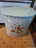 Front view of Detecto metal hamper with floral design