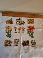 All twelve die-cuts arranged under ruler for scale