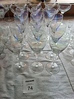 Group of iridescent stemmed glasses on table