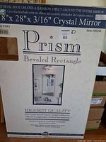 Front of retail box showing Prism branding and size 18" x 28" x 3/16" crystal mirror
