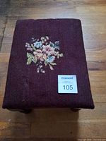 Top view showing needlepoint floral upholstery and size