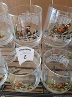 Moose design glasses stacked on rack