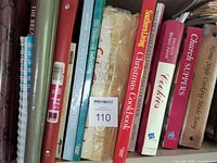 Center of shelf showing Southern Living Christmas Cookbook, Cookies and several spiral/binder cookbooks