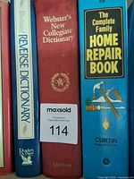 Close-up of Reverse Dictionary, Webster's Dictionary, Complete Family Home Repair Book spines