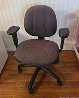 Full view of chair front showing seat, backrest, arms and base