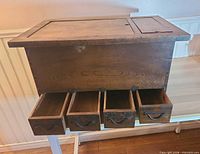 Front view of hibachi chest showing four drawers extended