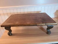 Full view of oak riser table on surface