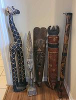 Group shot of all five carved wooden items