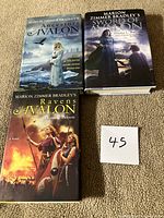 Front covers of all three Avalon hardcovers