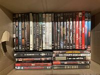 Boxed collection showing first layer of DVD spines and loose titles