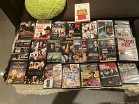 Overview of all DVD cases laid out on surface