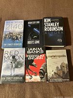 All six hardcover science fiction books front covers visible