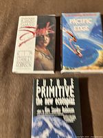 All three hardcover books front covers visible