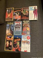 All ten VHS cases laid out showing cover art