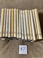 Spine view of all 15 Scientific American Library books