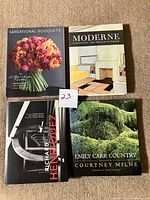 Group shot of all four hardcover books showing front covers