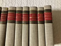 Close view of seven spine titles and uniform binding style