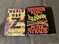 Front view of both hardcover books with dust jackets visible
