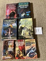 All seven books front covers displayed